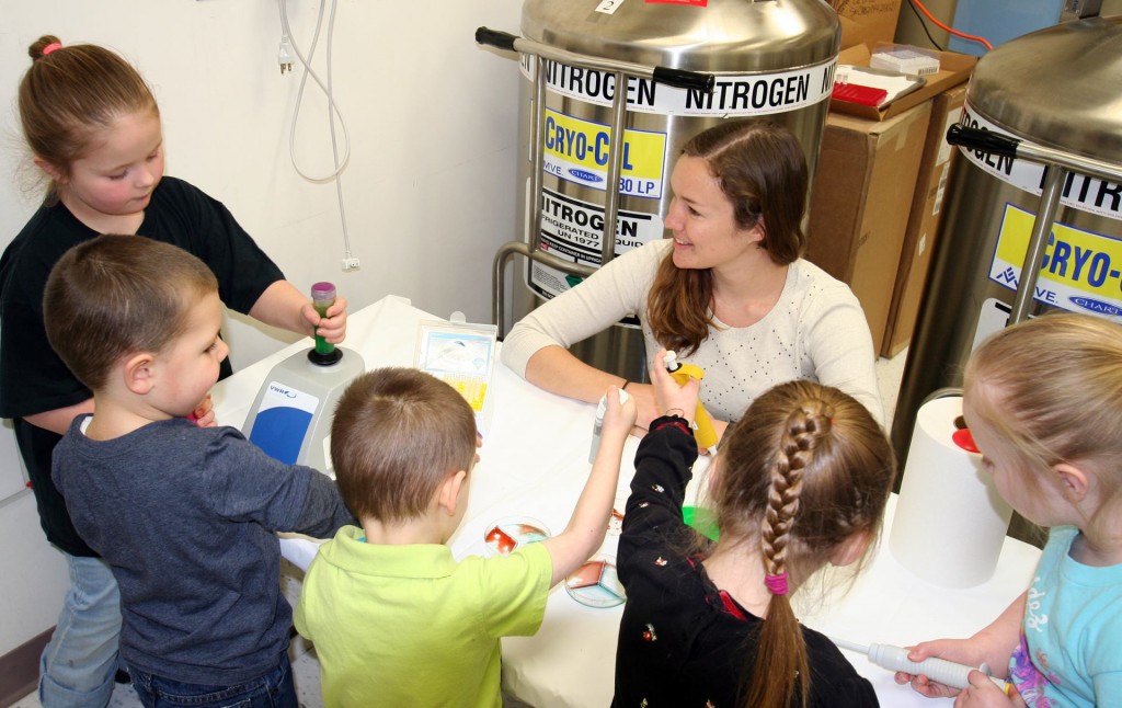 Katie works with students at the University of Alaska Fairbanks Museum of the North Open House (via Katie Everson)